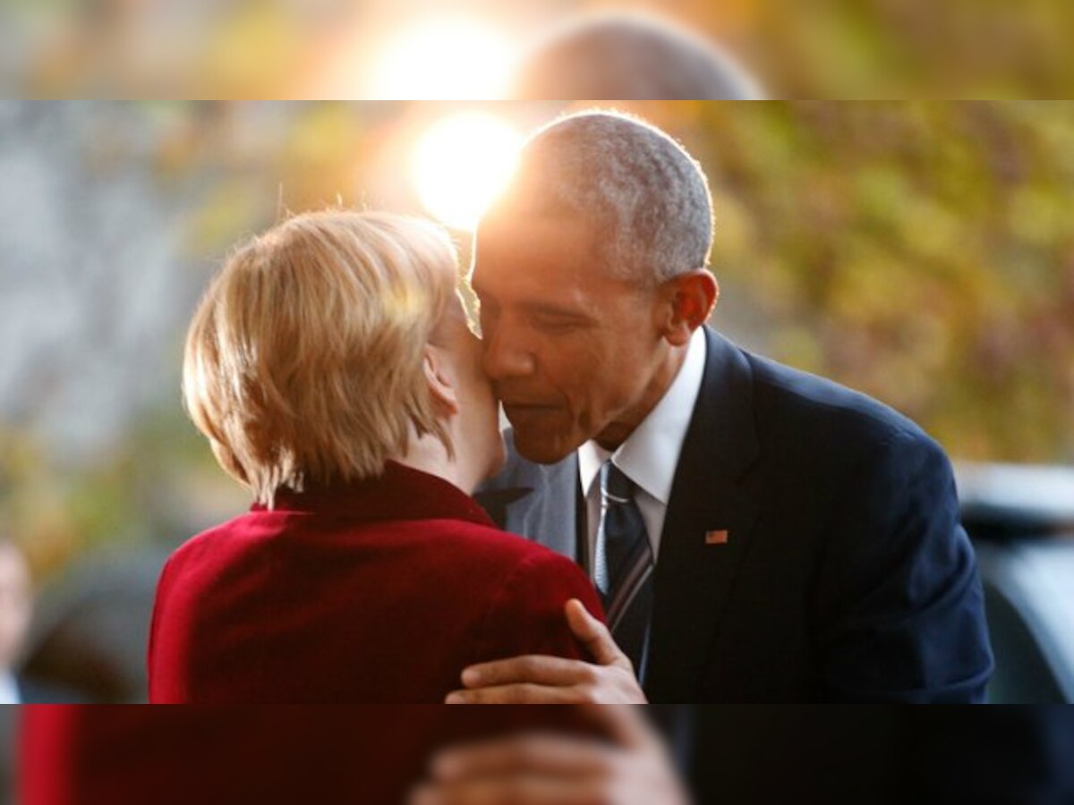 Barack Obama embraces Angela Merkel in Germany visit, prods Donald Trump on Russia