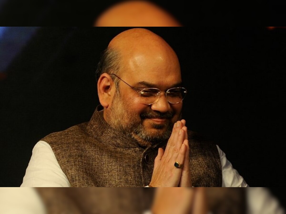 Amit Shah unfurls national flag at BJP headquarters in Delhi