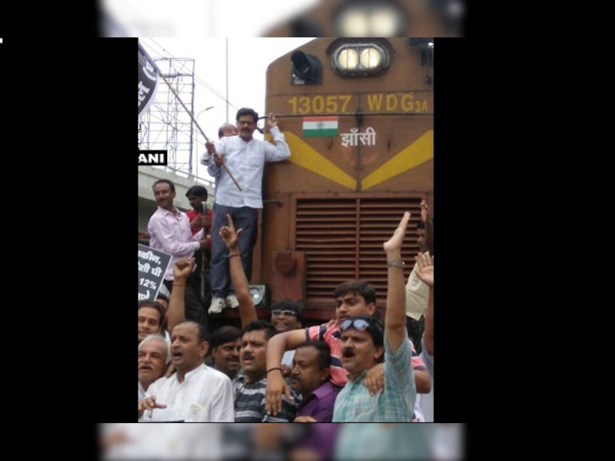 Uttar Pradesh: Traders protest GST, stop train; wholesale market shut down