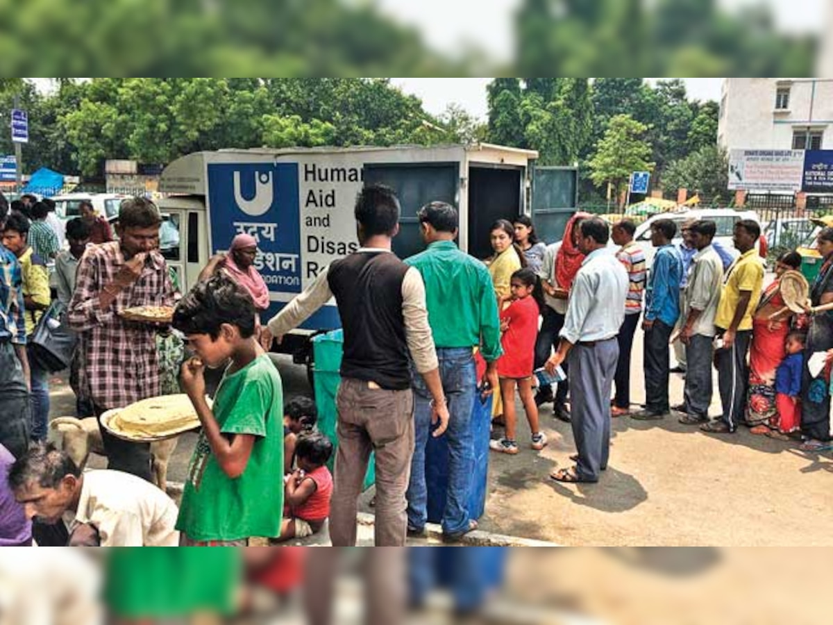 NGO sells newspaper to feed the needy outside AIIMS