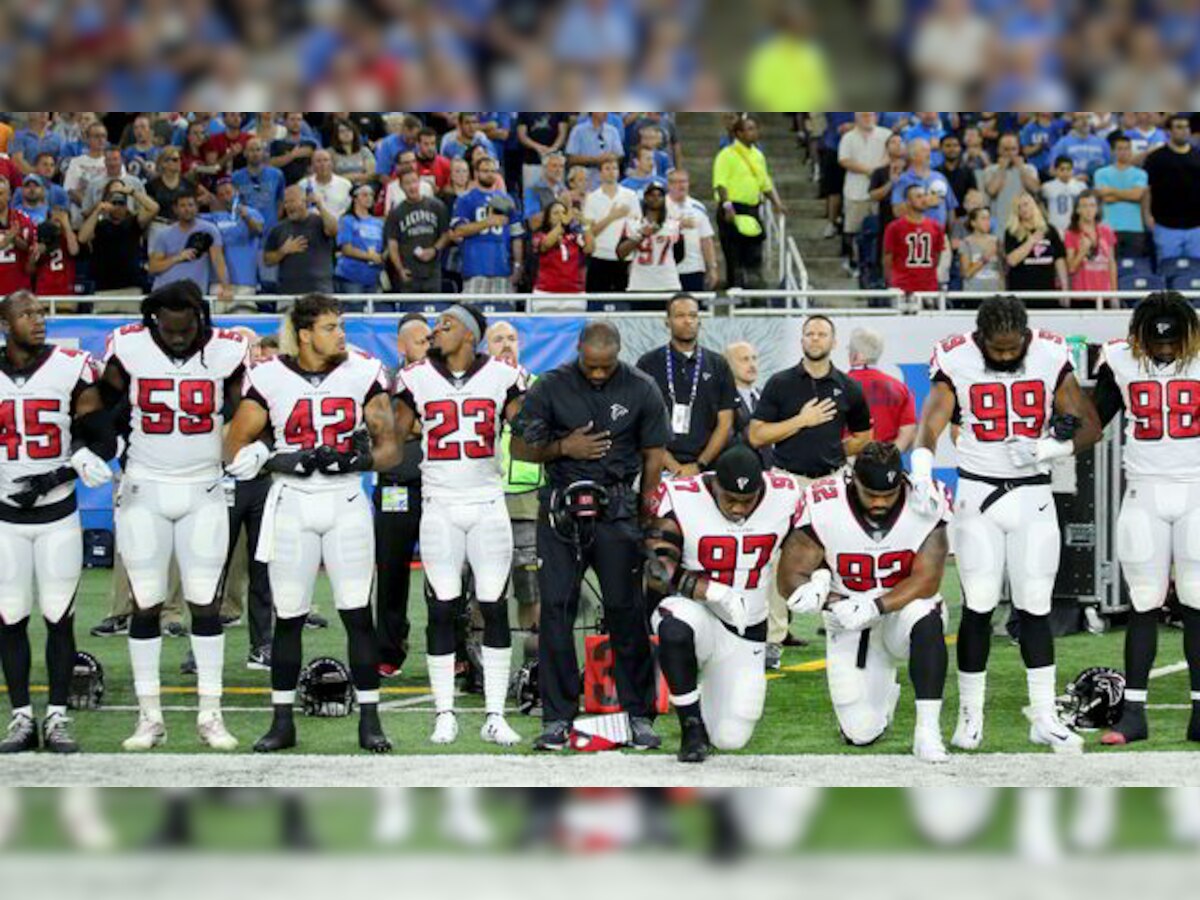 Kneeling nothing to do with race: Donald Trump continues tirade after NFL retaliates with show of solidarity