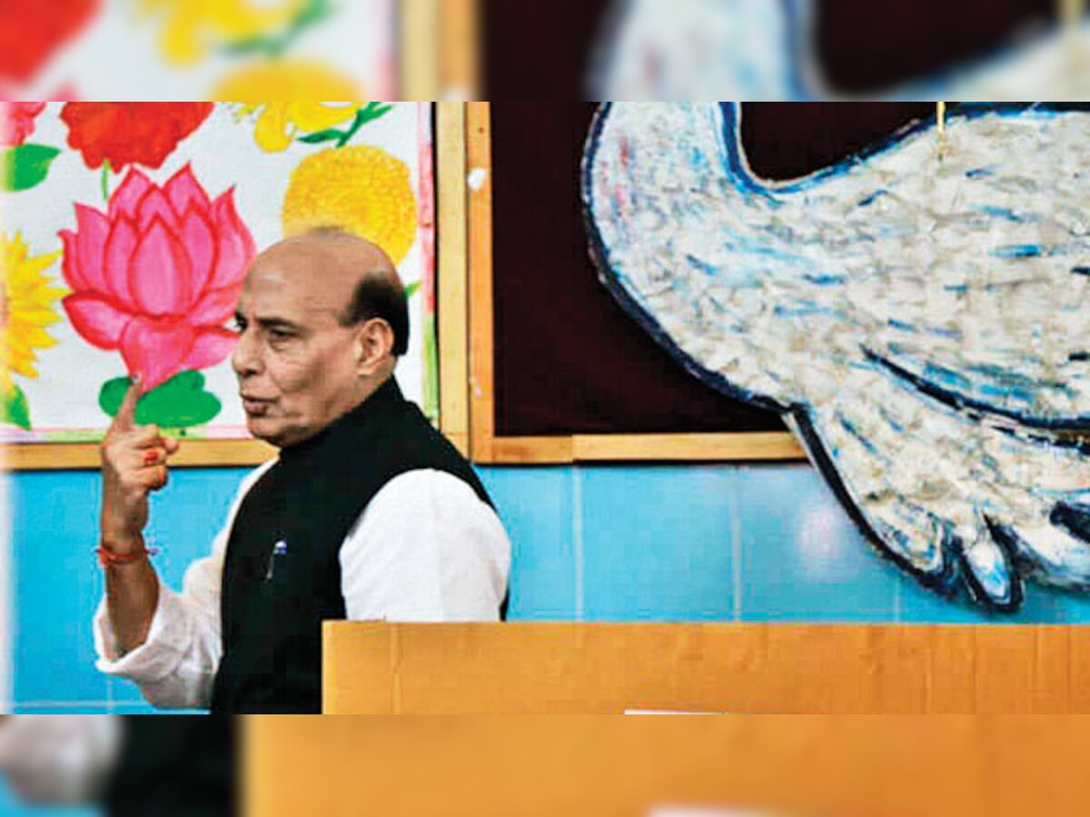 Rajnath Singh's picture with Lotus creates a row in Lucknow