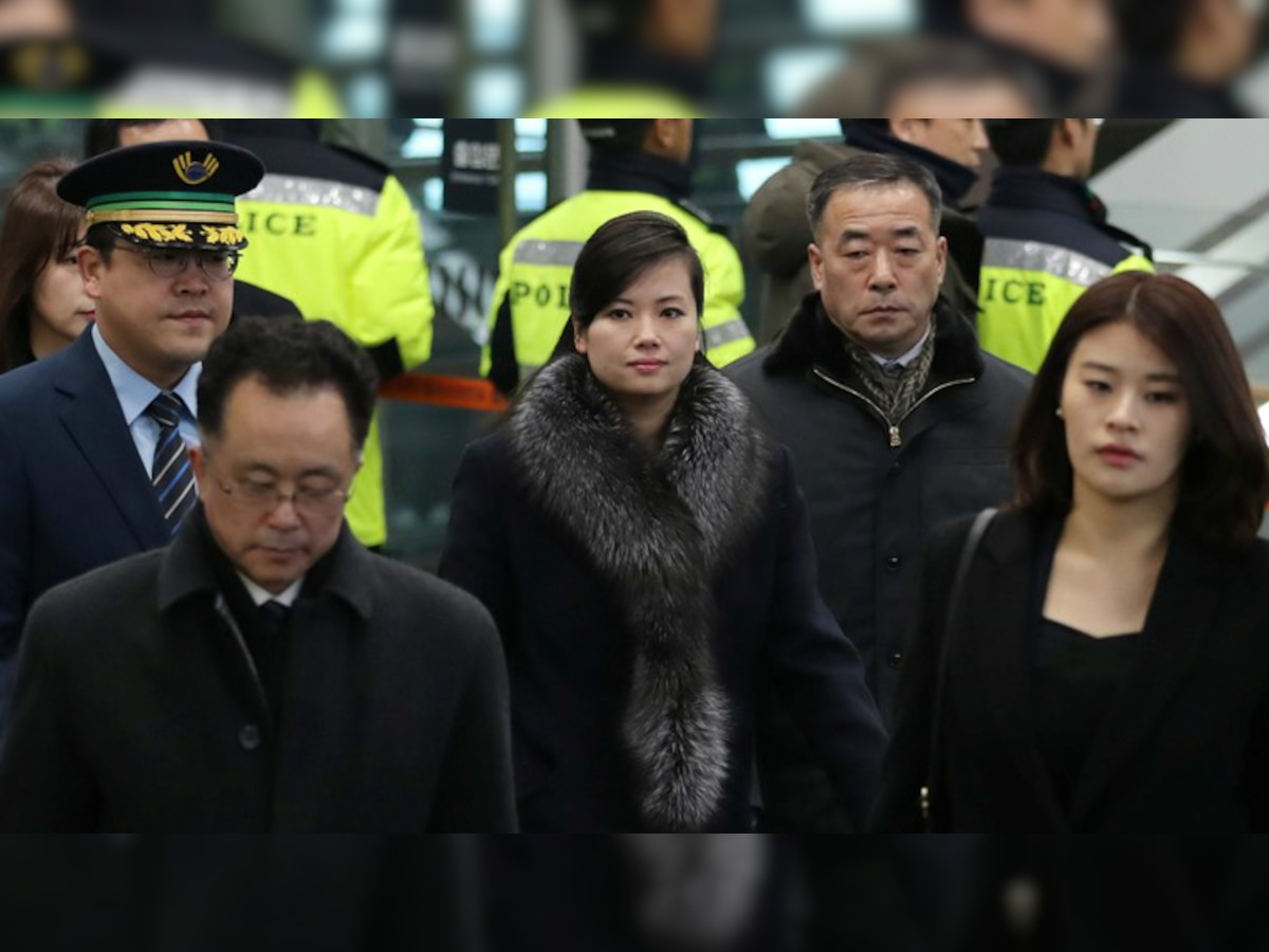 South Koreans burn Kim Jong Un's photo as North Korean band leader visits Seoul