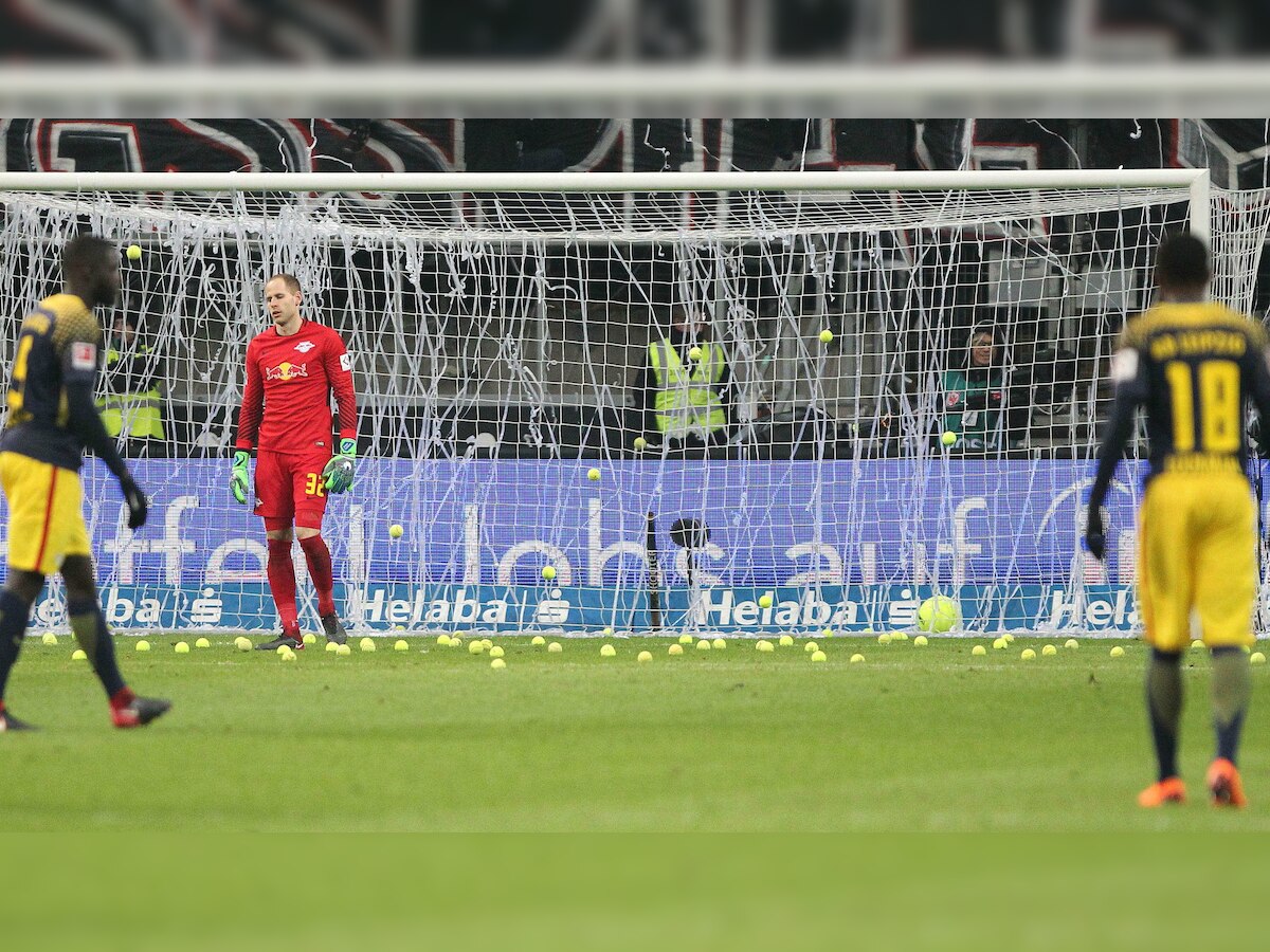 Fans flood pitch with tennis balls in Bundesliga Monday night