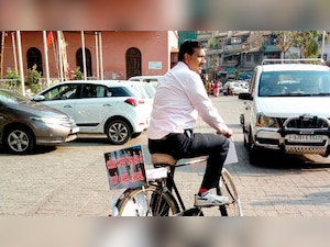 Councillor pedals with ‘Save Water’ message