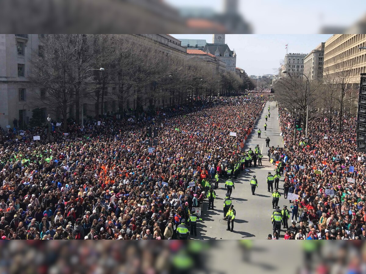 Massive crowds rally across US to demand tighter gun controls