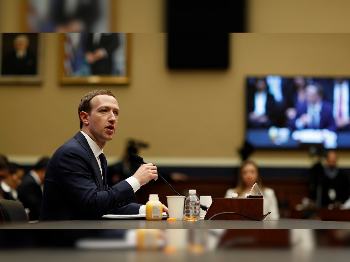 Facebook's Zuckerberg says his own data was shared by Cambridge Analytica, unscathed by congressional grilling