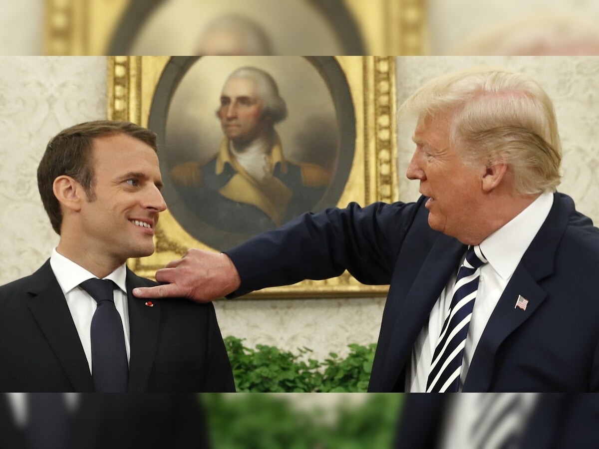 Not a Head & Shoulders ad: Watch Donald Trump brush off 'dandruff' from Macron's suit