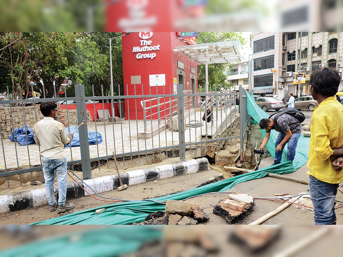 Pavement outside Greater Kailash Metro station caves in