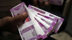 Rupee plunges 79 paise to record low of 69.62 against USD