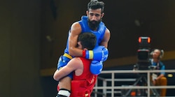 WATCH - Asian Games 2018: Iran's Wushu player wins hearts for carrying injured Indian opponent off the ring