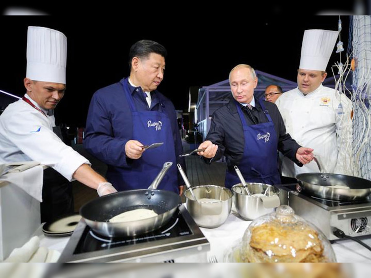 Vladimir Putin, Xi Jinping flip pancakes at Russian economic forum