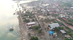 At least 832 dead in Indonesia tsunami, many trapped