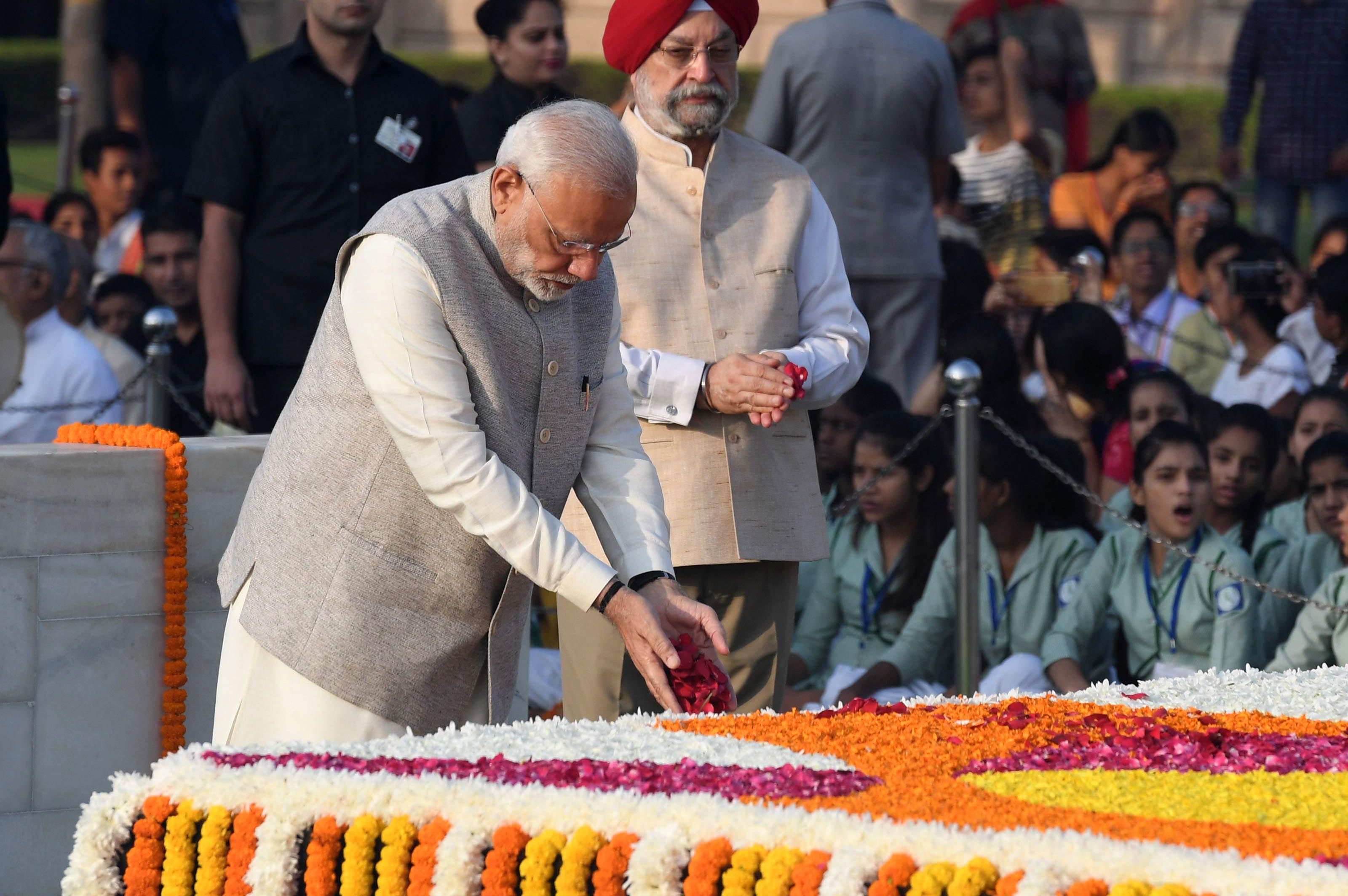 PM Modi pays tribute at Rajghat, the memorial to Mahatma Gandhi, in New Delhi on October 2