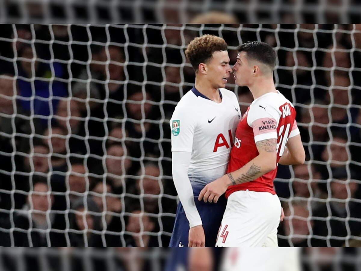 League Cup: Tottenham's Dele Alli hit by bottle in derby win at Arsenal