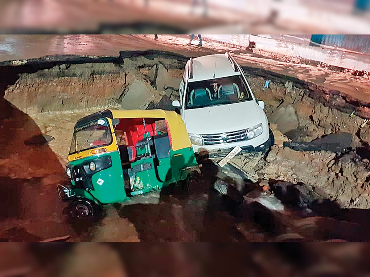 Delhi: Road near Metro station caves in, vehicles trapped in sinkhole