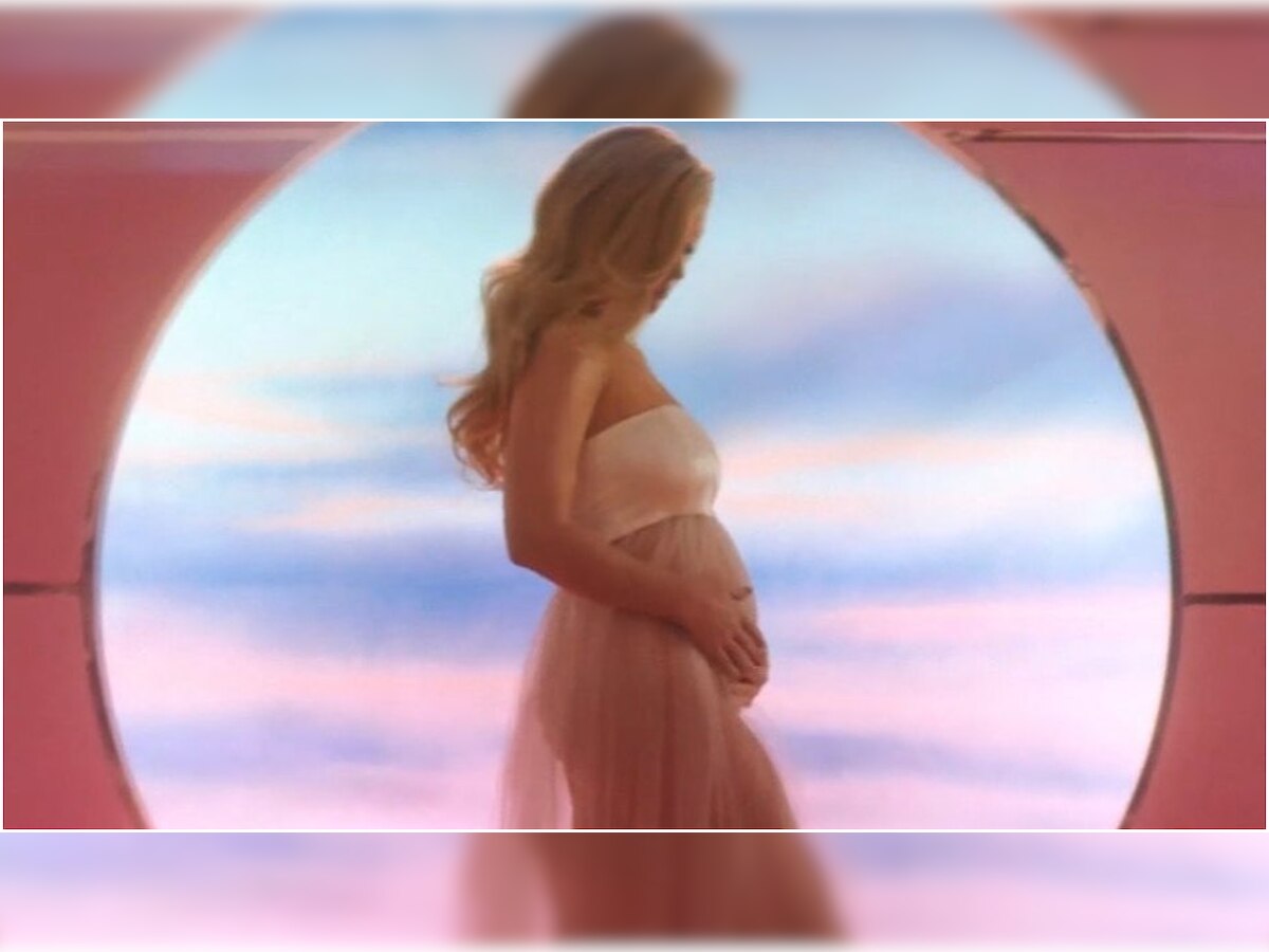 Katy Perry sweetly cradles baby bump in 'Never Worn White' music video