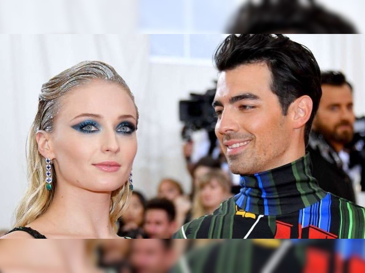 Photos: Mom-to-be Sophie Turner cradles her baby bump as she heads out for stroll with Joe Jonas, her mom