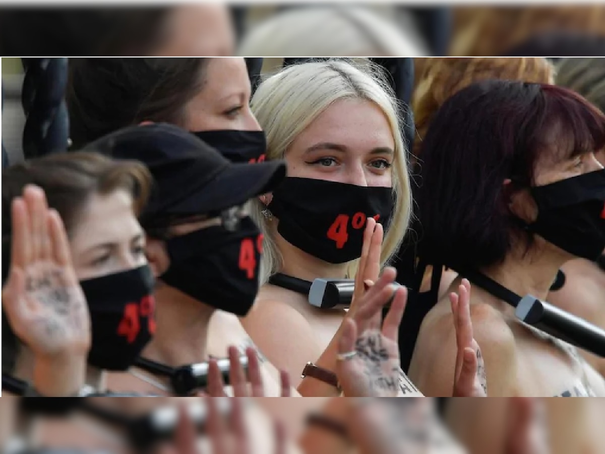 Bare-chested women lock themselves to UK Parliament in climate protest