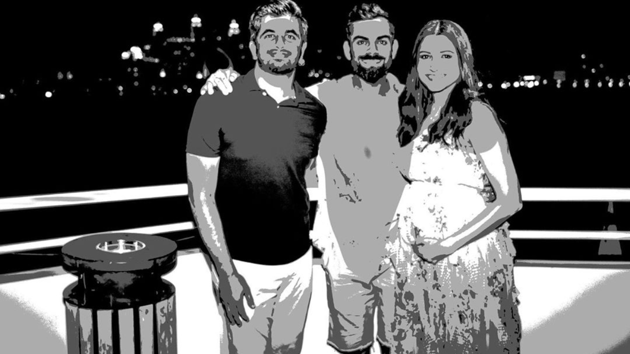 RCB photographer almost misses a cute picture of Virushka in the middle of Kohli's birthday bash RCB photographer almost misses a cute picture of Virushka in the middle of Kohli's birthday bash