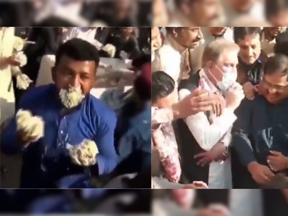 Video: Pakistanis fight each other for cake, Foreign Minister tries to eat with his mask on