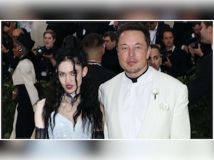 Tesla CEO Elon Musk's girlfriend Grimes goes topless to flaunt new