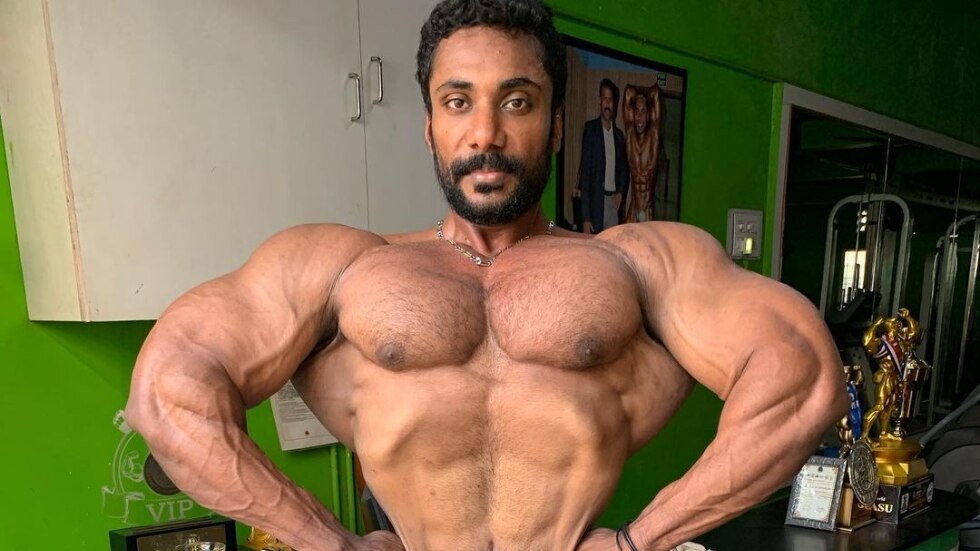 Photo PUNE, MAHARASHTRA, INDIA, 29th March 2018, Young bodybuilder showing  chest and biceps muscles in front pose, Indian Body Builders Association  show, Balewadi, Baner Image #11995725