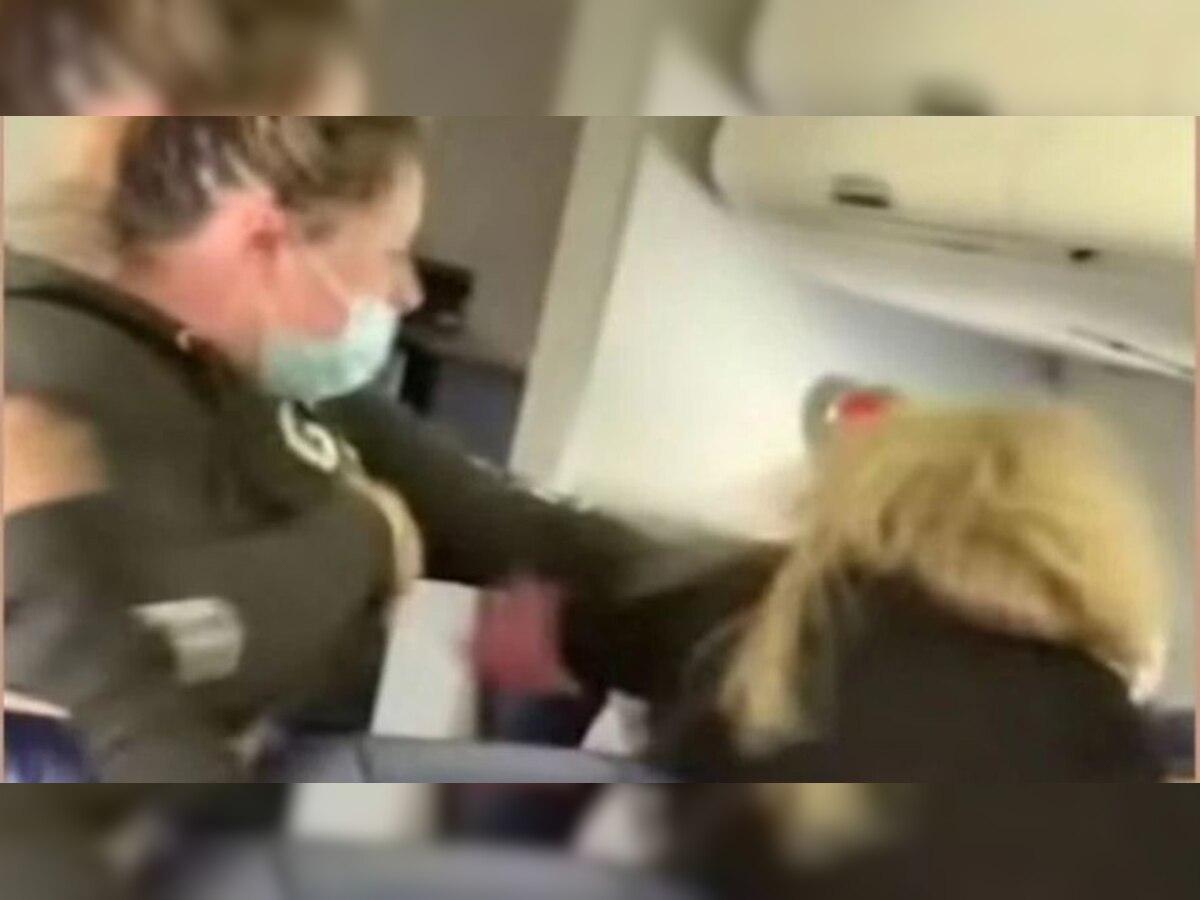 Woman passenger hits flight attendant in the face, breaks two teeth - Video goes viral