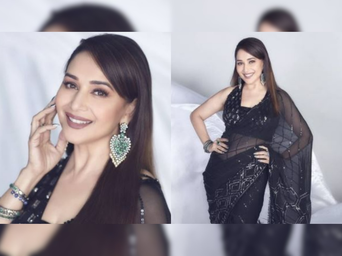 Madhuri Dixit is the epitome of grace in a semi-sheer black saree designed by Manish Malhotra - see pics