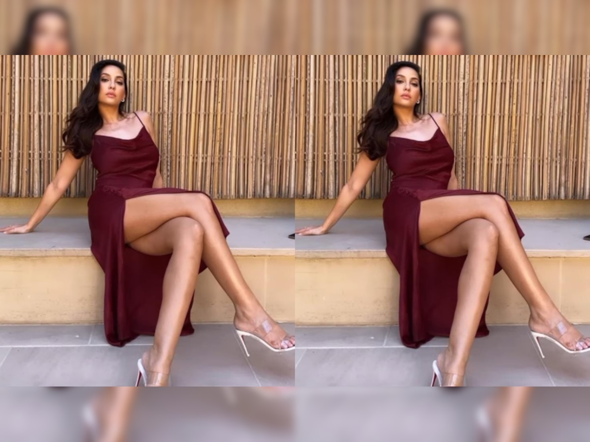 Nora Fatehi flaunts her curves in maroon dress featuring thigh-high slit - See VIRAL photo