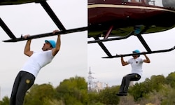 Man creates world record for most pull-ups while hanging from helicopter – WATCH viral video