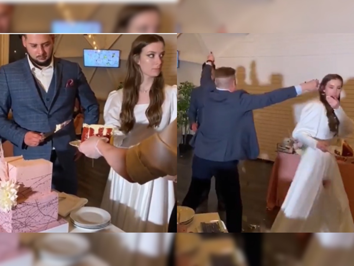 Bride and groom left shocked after man destroys their wedding cake, watch viral video