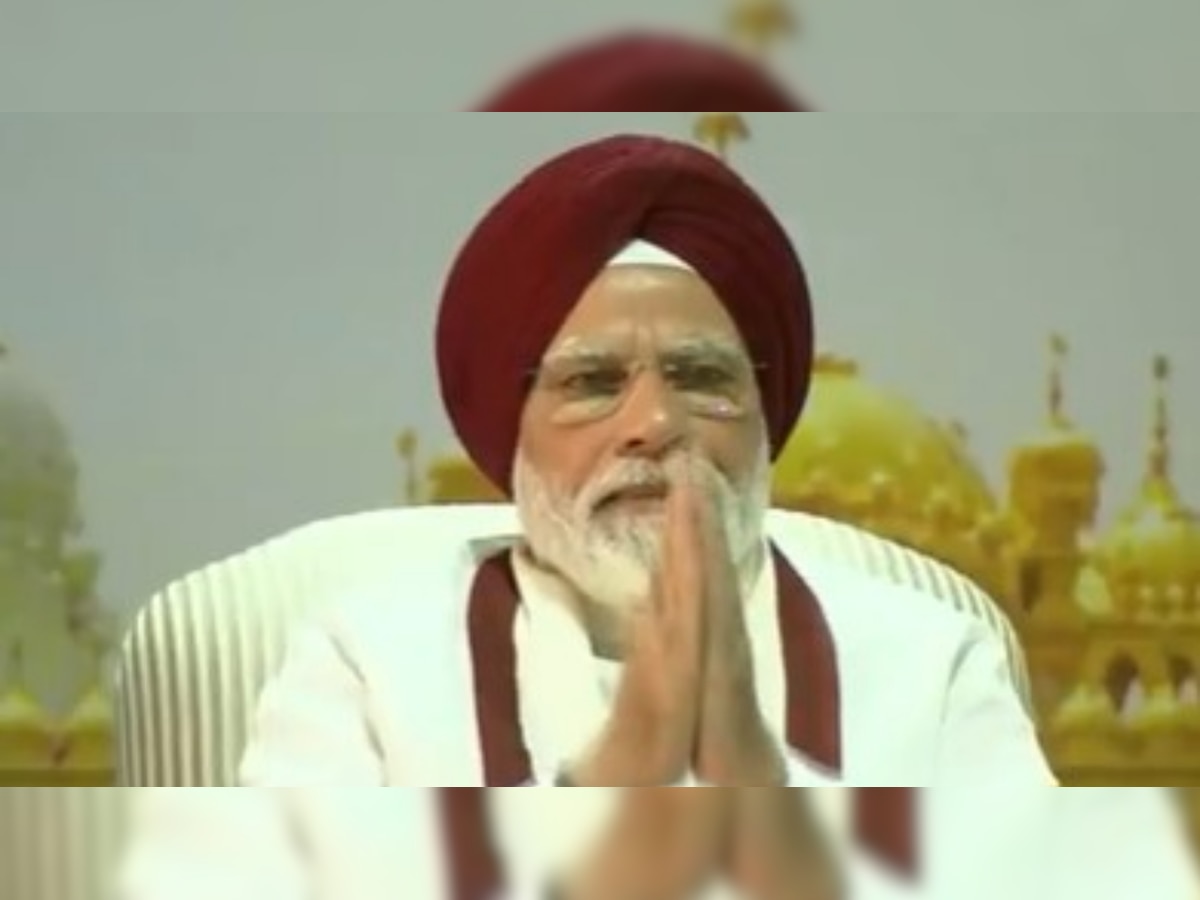 PM Modi adorns red turban to meet Sikh delegation at Delhi residence