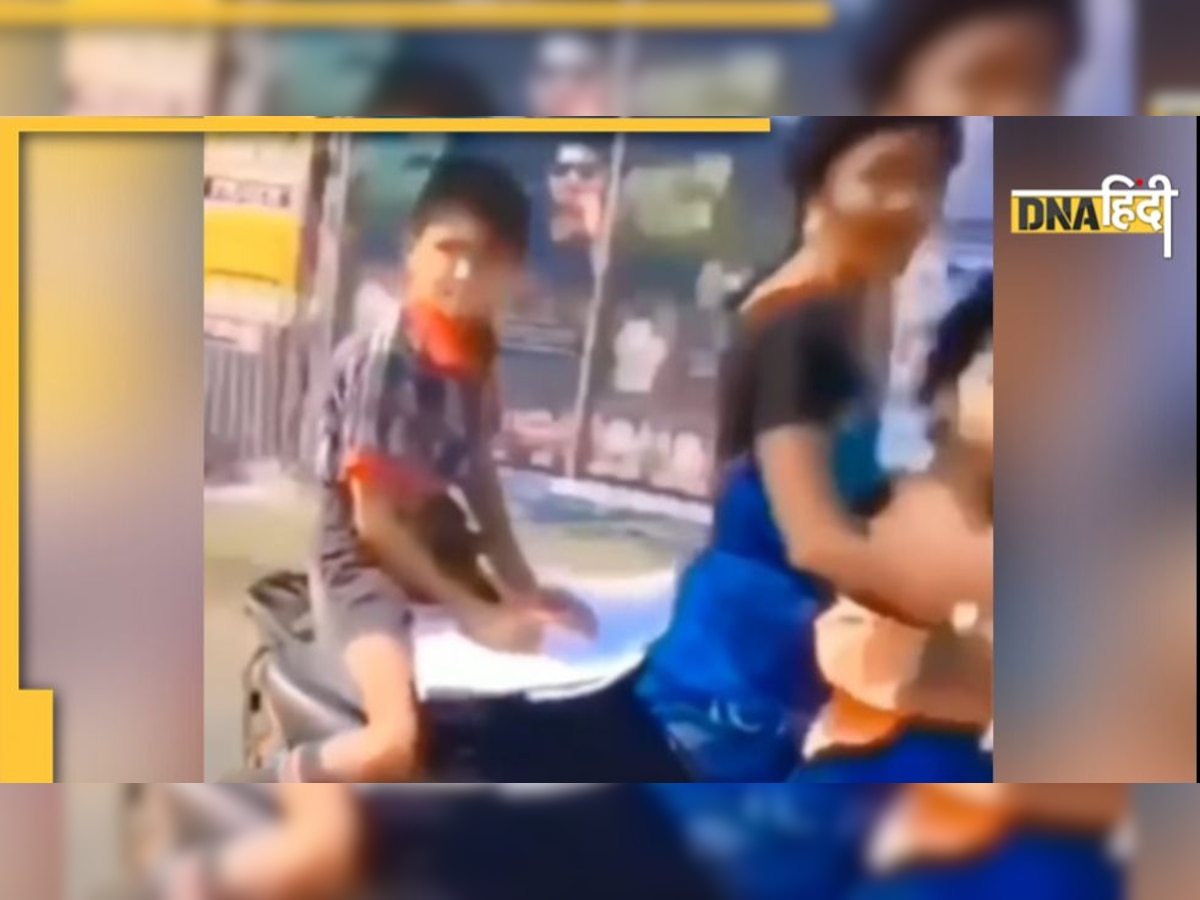 Viral Video: चलती स्कूटी में पीछे बैठकर होमवर्क कर रहा था लड़का, 'खतरों के खिलाड़ी' का वीडियो वायरल