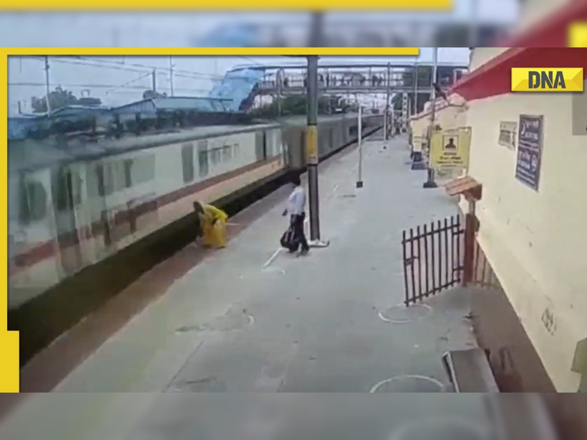 Watch: Woman crossing railway tracks saved by official seconds before train's arrival