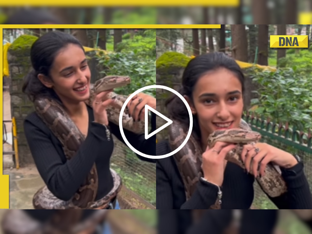 Girl kisses massive python in THIS hair-raising viral video; Internet reacts