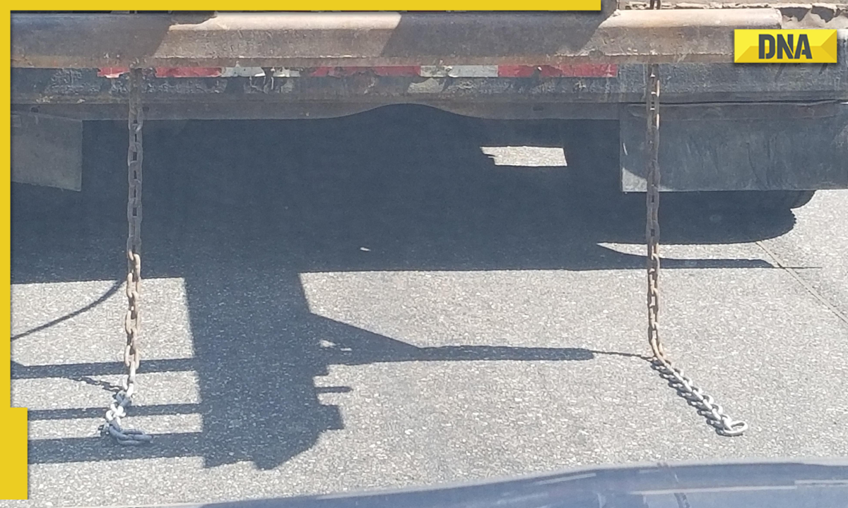 Why do trucks and buses have chains hanging at the back