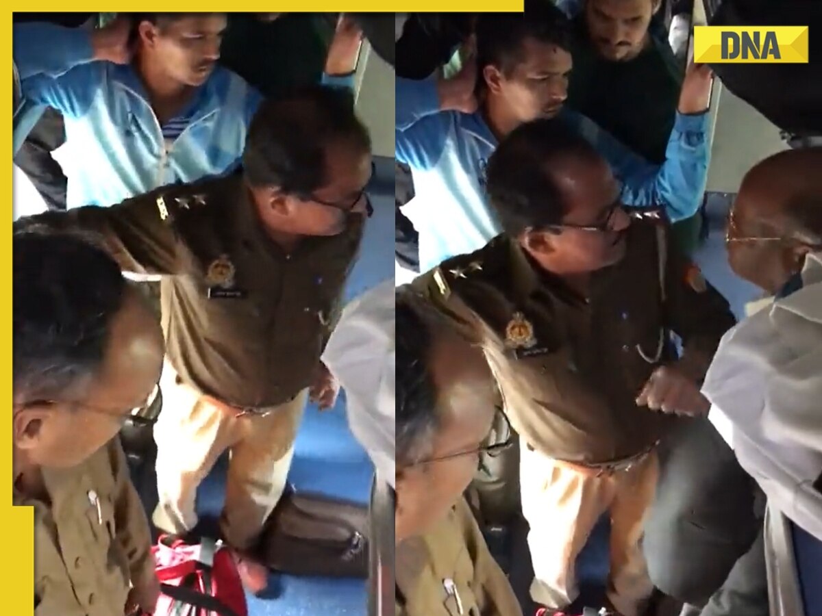 Watch: Elderly TTE bravely stands up to officers of UP Police travelling without ticket in train, video goes viral