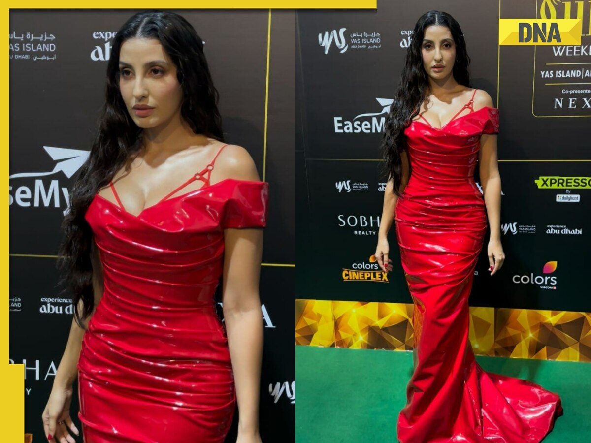 Ramya Nambessan's look in a red gown and long floral jacket is on fleek!