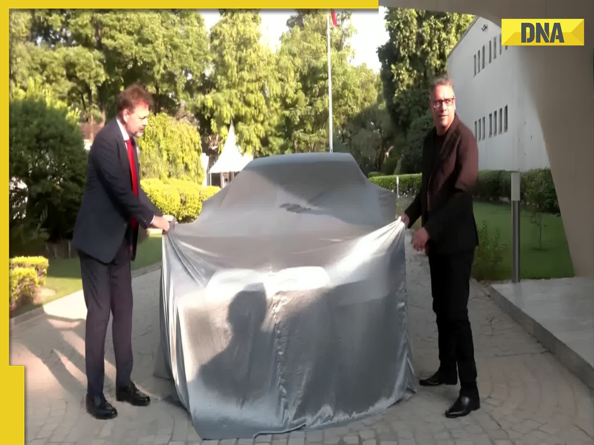 German Ambassador ties 'nimbu-mirchi' to his new EV, smashes coconut, WATCH viral video