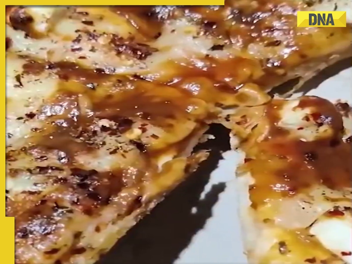 Viral video: Man finds live worm in pizza ordered online, furious netizens demand action, WATCH 