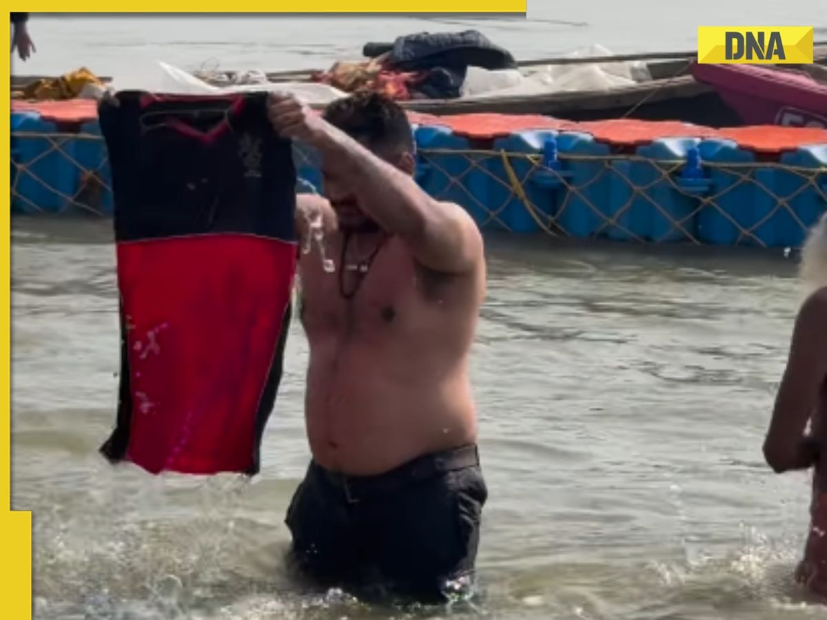 Man dips RCB jersey in Sangam at Mahakumbh, viral video sparks outrage, netizens say, 'please don’t do...'