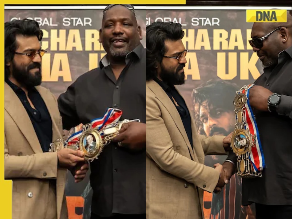 This man of Ram Charan's right is British heavyweight champion boxer, fought Mike Tyson, he's now working as bouncer of RRR star, his name is...