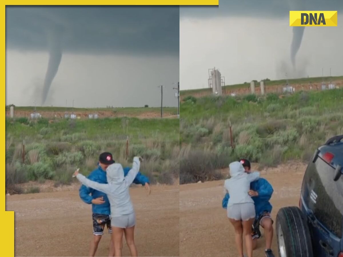 Viral video: Man proposes to girlfriend with tornado swirling behind them, netizens say 'perfect proposal'