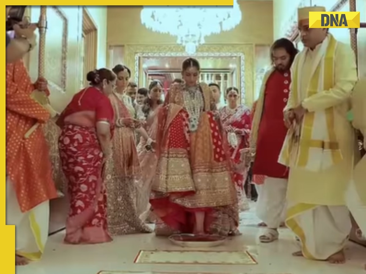 Mukesh Ambani, Nita Ambani’s 'choti bahu' Radhika Merchant performs griha parvesh in traditional red lehnga with Anant Ambani, video goes viral, watch