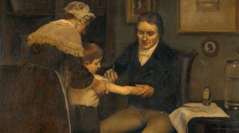 Edward Jenner during giving vaccination