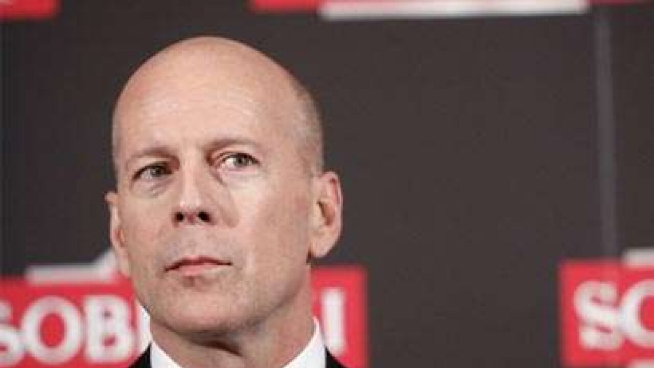 Bruce Willis escapes injury after escalator malfunction