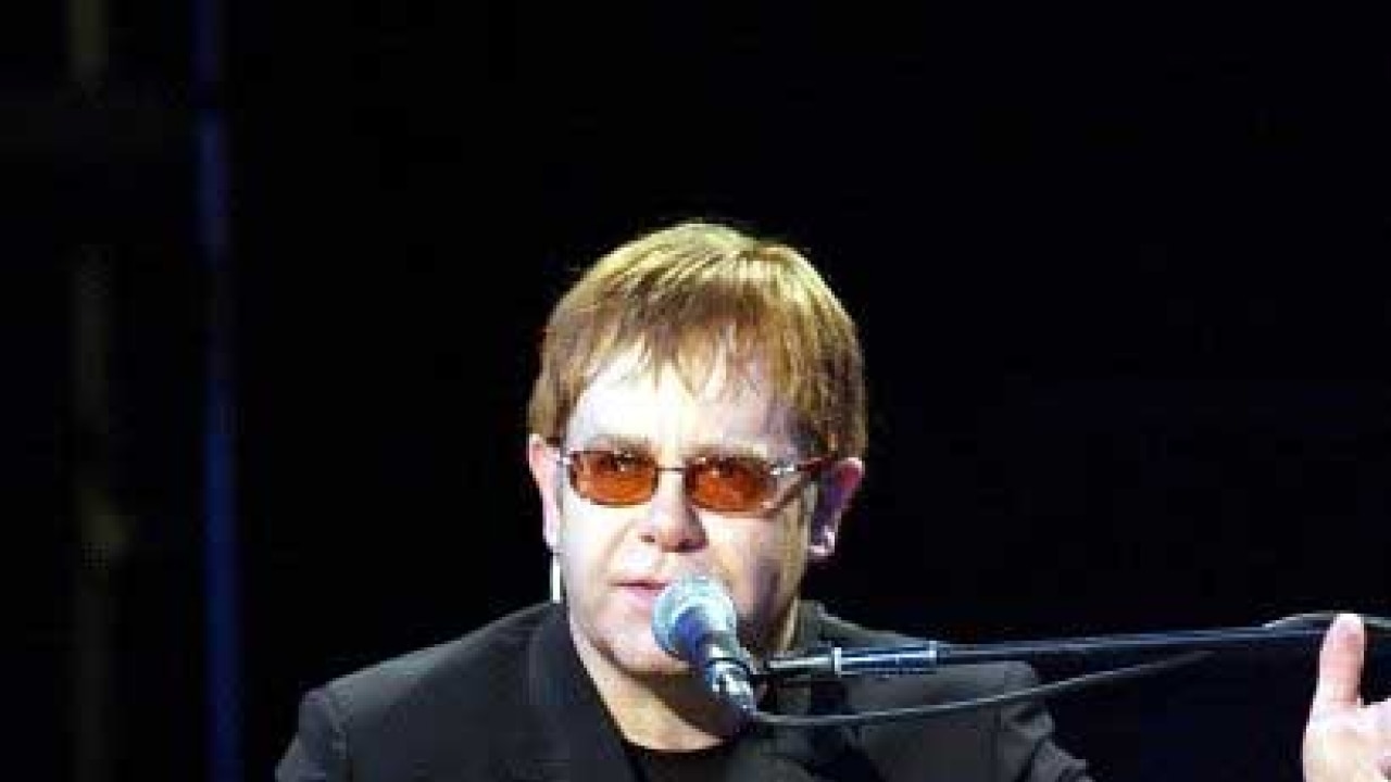 Sir elton john shows off his son for the first time