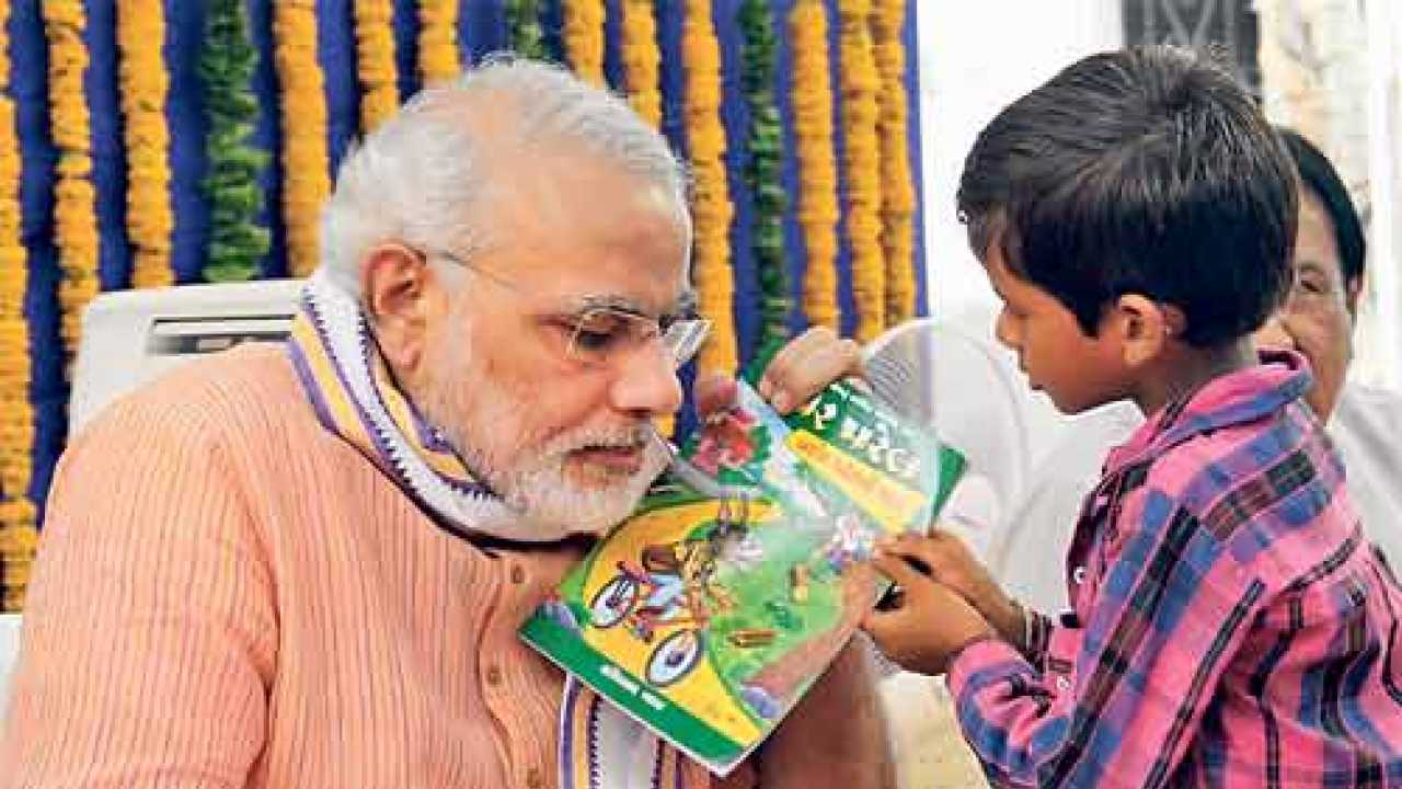 CM Narendra Modi goes to school with homework done