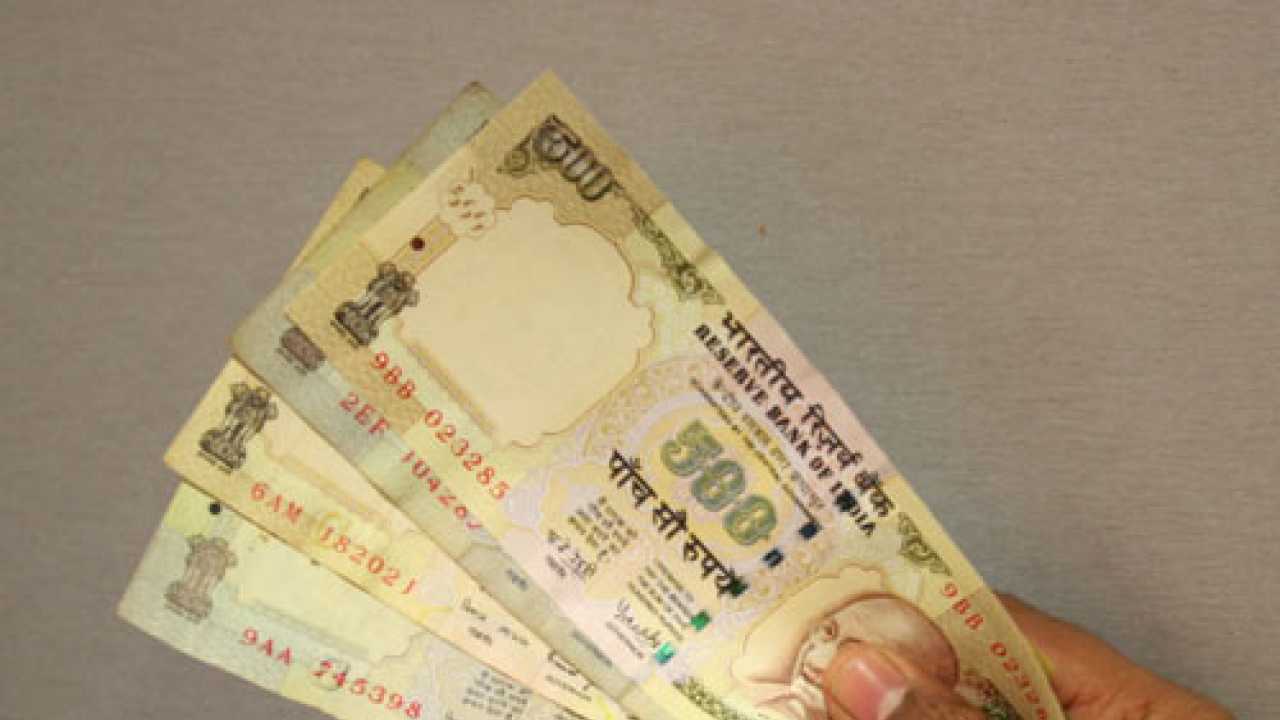Rupee slips below 62 against dollar; Sensex tanks over 700 points